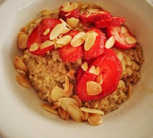 Quinoa Porridge with Sliced Strawberries & Chia Seeds